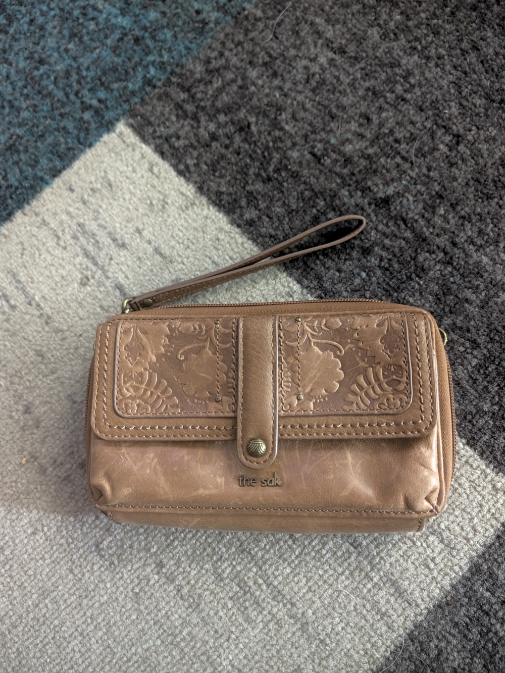 The Sak embossed leather wristlet in light brown